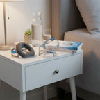 AI-generated contextual nightstand image of ResMed AirTouch N20 nasal mask system.