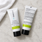 Two Mary Kay Clear Proof Oil-Free Moisturizer tubes arranged on a pale stone surface