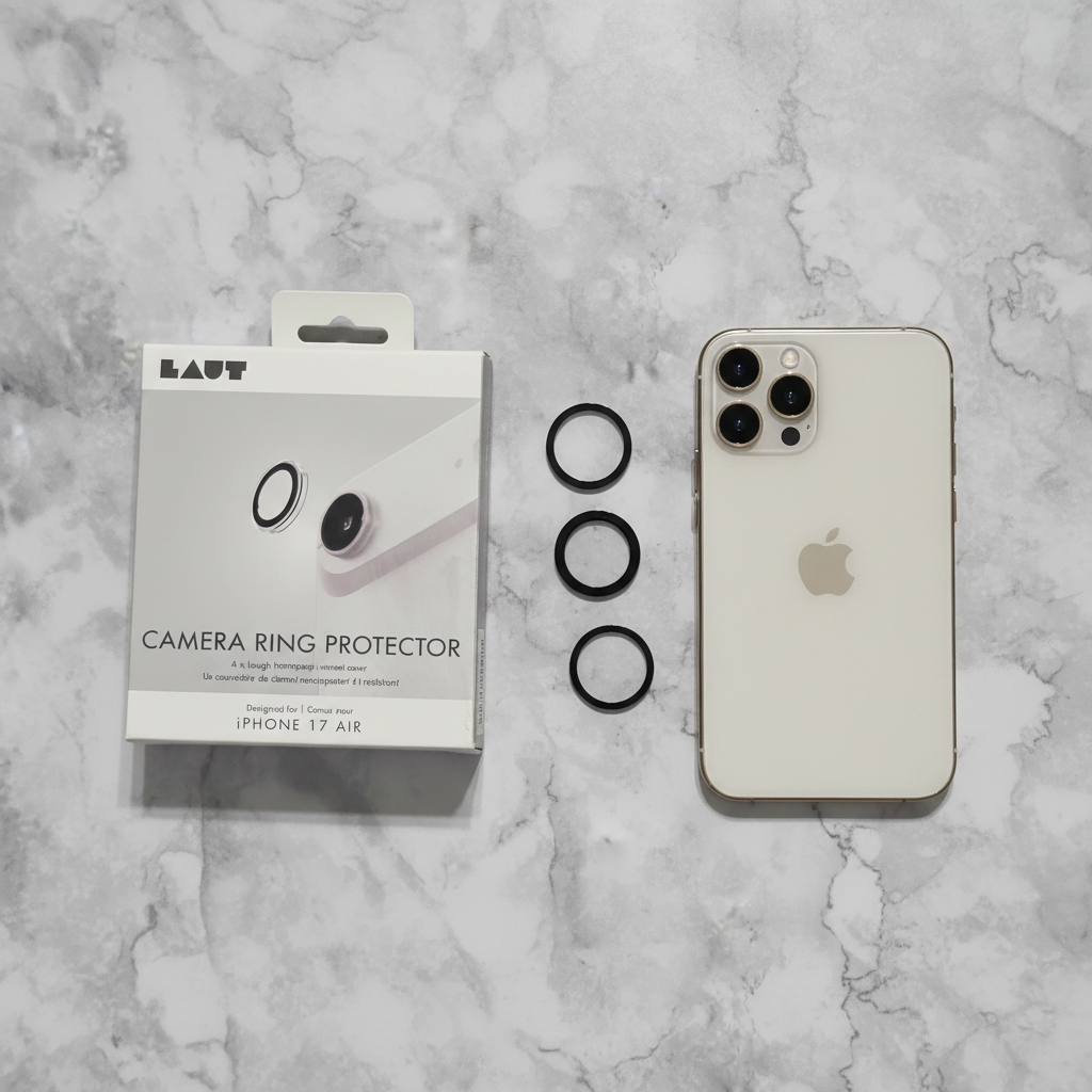 Overhead flat lay of LAUT Camera Ring Protector packaging, ring components, and iPhone on white marble