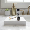 Vixen Prism crystal essential oil roller and carton displayed on a white vanity; the Discovery Duo includes Prism and Happiness, 10 mL each