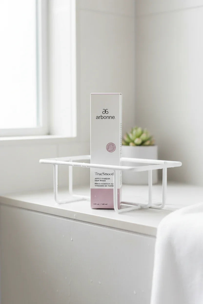 Arbonne TrueSmooth Apple Vinegar Hair Rinse in minimalist shower caddy spa bathroom lifestyle