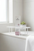 Arbonne TrueSmooth Apple Vinegar Hair Rinse in minimalist shower caddy spa bathroom lifestyle