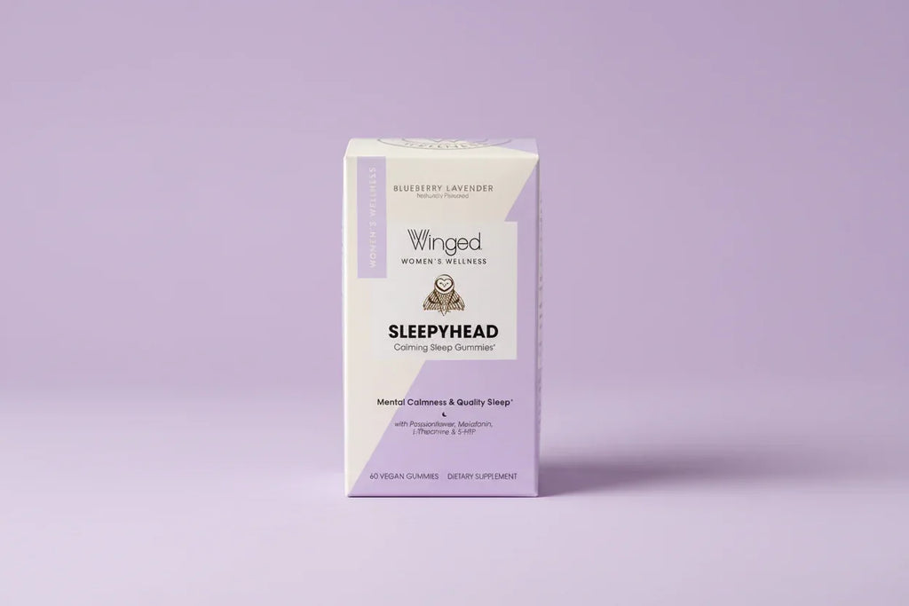 Winged Wellness Sleepyhead retail box on soft lavender studio background