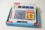 Fisher-Price Learn and Doodle Desk close-up LCD screen showing dog drawing with stencil cards displayed - More4less Outlet