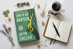 How to Say Babylon by Safiya Sinclair hardcover flat lay with journal pen dried flowers and coffee on white linen – More4less Outlet