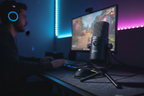 JLab GO Talk USB Microphone on a gaming desk with RGB lighting — plug and play USB mic for streaming and gaming — More4less Outlet