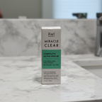 Rael Beauty Miracle Clear Acne Serum white and green box in soft natural window light on white quartz countertop – More4less Outlet