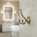 Elegant champagne bronze Delta Cassidy robe hook installed inside a luxury master bath space
