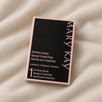 AI-generated lifestyle photo of the Mary Kay Blending Sponge box on soft fabric