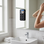 Samsung smartphone with black suction cup case mounted hands-free on bathroom mirror