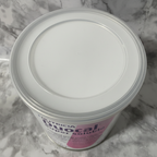 Close detail of the sealed lid and upper rim of a Nutricia Duocal 400 g can