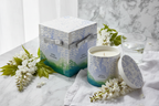 Thymes White Wisteria Aromatic Candle decorative gift box open on white marble with fresh wisteria sprigs - More4less Outlet