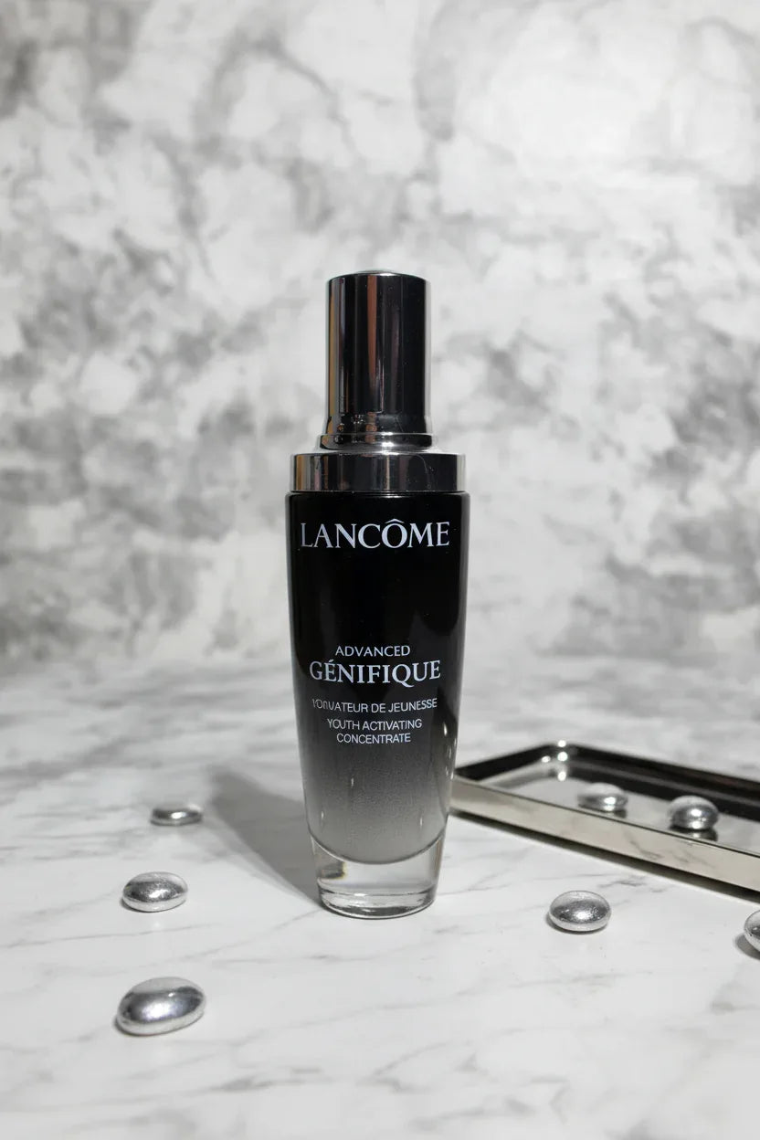 Luxury dark glass skincare serum bottle on a pristine white marble vanity with soft dramatic lighting
