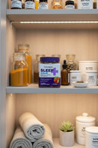 Natrol Sleep+ Calm Gummies jar in home apothecary wellness cabinet with glass supplement containers — More4less Outlet