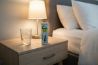 Modern nightstand setup with a glass of water and Will Relieve topical analgesic roll-on box