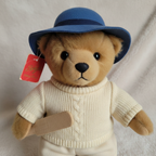 Augusta du Bay Paddington Bear plush close-up brown fur black button nose cream cricket outfit blue hat red hangtag collectible detail - More4less Outlet