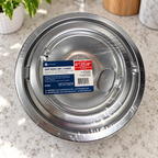 GE GE68C sealed four-pack chrome drip bowls in kitchen setting 1; AI-generated lifestyle illustration