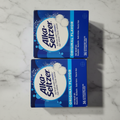 Two Alka-Seltzer boxes on marble countertop