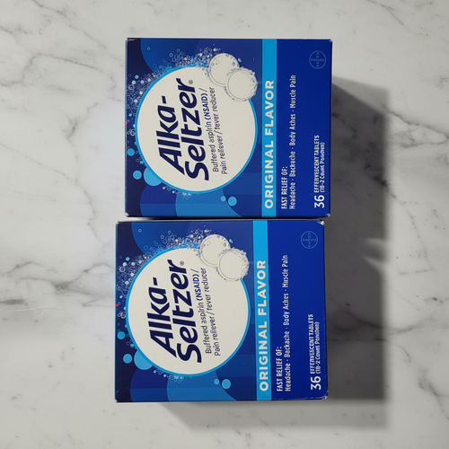 Two Alka-Seltzer boxes on marble countertop