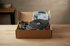 Kitchen appliance maintenance parts and tools arranged on a clean workbench
