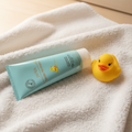 JAFRA Tender Moments Baby Massage Cream on fluffy white towel with rubber duck – More4less Outlet