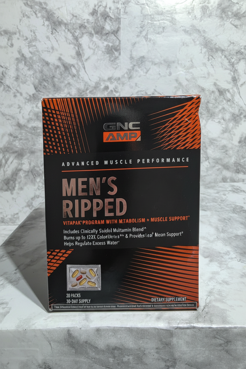 GNC AMP Men's Ripped Vitapak 30 pack box displayed on marble with bold orange graphics