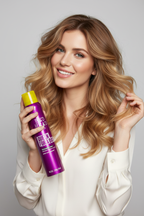 Bed Head TIGI Queen For A Day held by woman with voluminous bouncy hair
