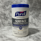 Studio product photograph of Purell Professional Surface Disinfecting Wipes canister on grey marble counter