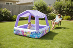 Baby splashing in Intex Sun Shade Pool with removable purple canopy on backyard lawn - More4less Outlet