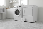 Kidde Smart Water Leak + Freeze Detector behind washing machine in laundry room – Wi-Fi smart home safety device – More4less Outlet