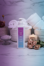 Pacifica Dream Moon Body Lotion on marble vanity with dried pink roses and sandalwood candle