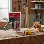 Arrow JT21 Stapler on wooden carpenter's workbench next to tape measure and wood-scraps project