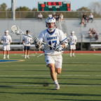 Lacrosse player wearing mouthguard during outdoor game