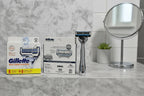 Gillette SkinGuard blade refill cartridges on bathroom shelf men's grooming lifestyle