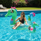 PoolCandy Glitter Seahorse pool tube floating in sunny backyard swimming pool with drink float