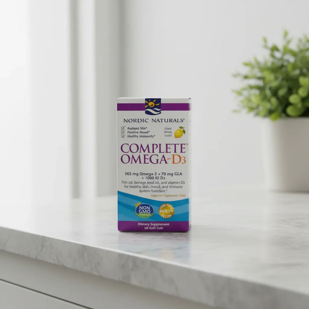 Clean lifestyle photo of Nordic Naturals supplement box resting on natural stone vanity surface