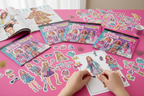 Barbie Extra fashion sticker pad on pink craft table with fashion magazines and glitter in fun kids styling activity scene