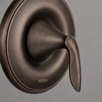 AI-styled close up of the Moen Eva oil-rubbed bronze lever handle finish