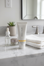 Rodan + Fields REVERSE Deep Exfoliating Cleanser 30mL tube on clean marble bathroom vanity