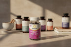 RenewLife Women's Care gummy bottle on wellness pantry neutral stone surface high-end supplements