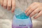 Child scooping into Disney Frozen Ice Reveal Squishy Ice gel to discover hidden surprises