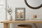 Lifestyle tabletop vignette featuring home photography display in contemporary farmhouse decor