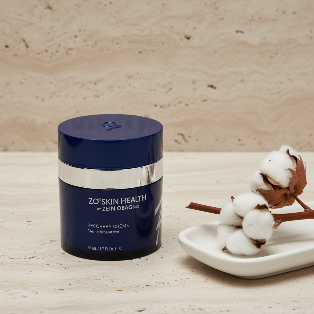 ZO Skin Health Recovery Crème navy blue jar on travertine stone surface with ceramic tray and cotton stem