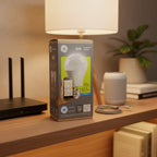 GE Link A19 Connected LED Bulb box standing on organized storage shelf with high-end tech essentials under warm residential lighting