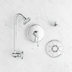 Grohe Fairborn polished chrome shower trim set components flat lay on white marble showing escutcheon plate lever handle shower arm flange and multi-spray shower head