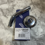 Grohe Classic II polished chrome shower arm and dome flange flat lay on white marble surface next to original Grohe retail box