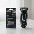 Braun Series 3 31S silver foil and cutter shaver head replacement black retail pack beside compact electric shaver on white marble – More4less Outlet