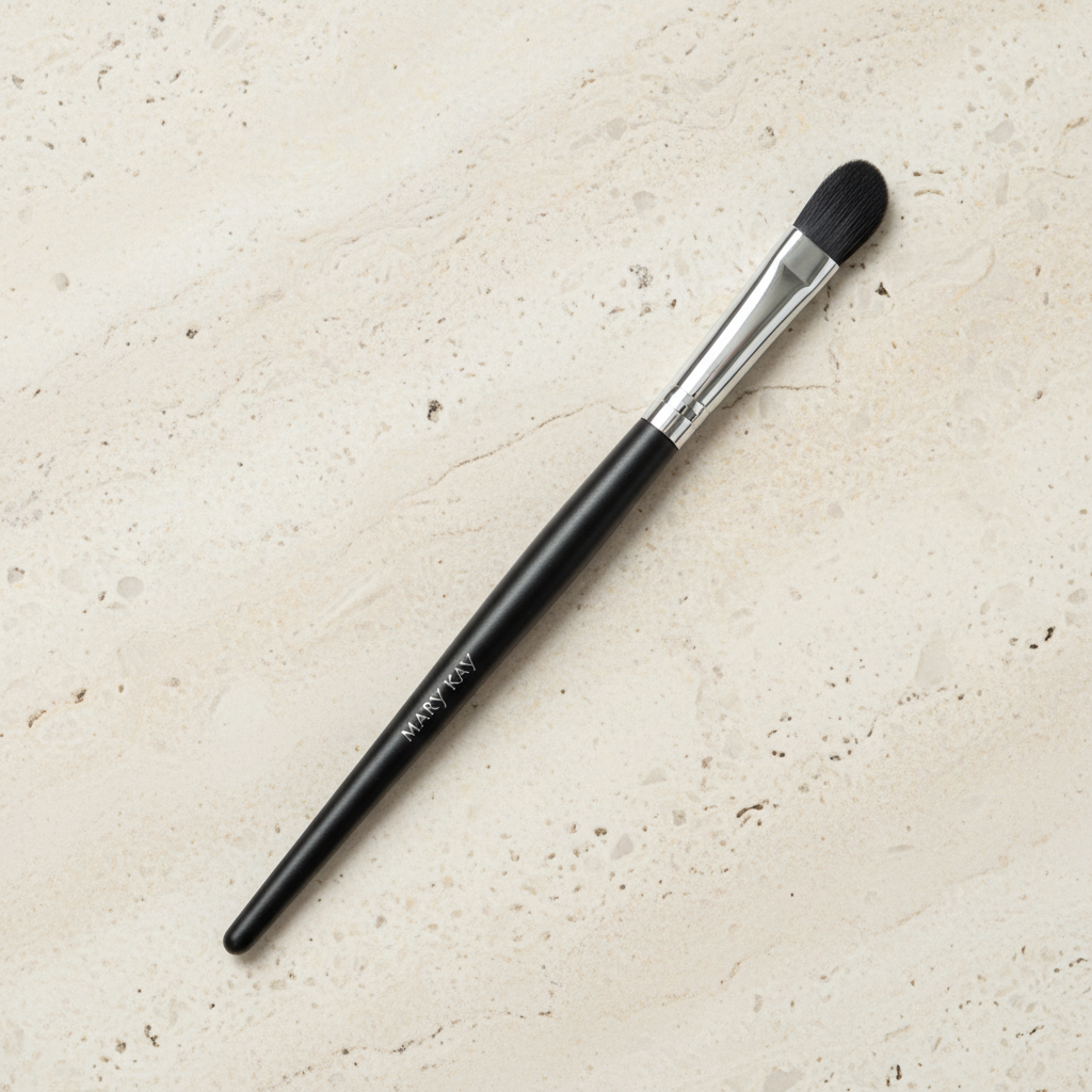 Mary Kay Eye Crease Brush on a light stone surface