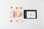 Sphero Mini orange robotic ball STEM flat lay with retail box tablet showing Sphero app mini cones and bowling pins – More4less Outlet