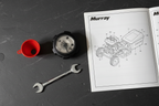 Stens 125-260 fuel cap with Kelch gauge flatlay on dark slate with wrench and Murray parts manual - More4less Outlet